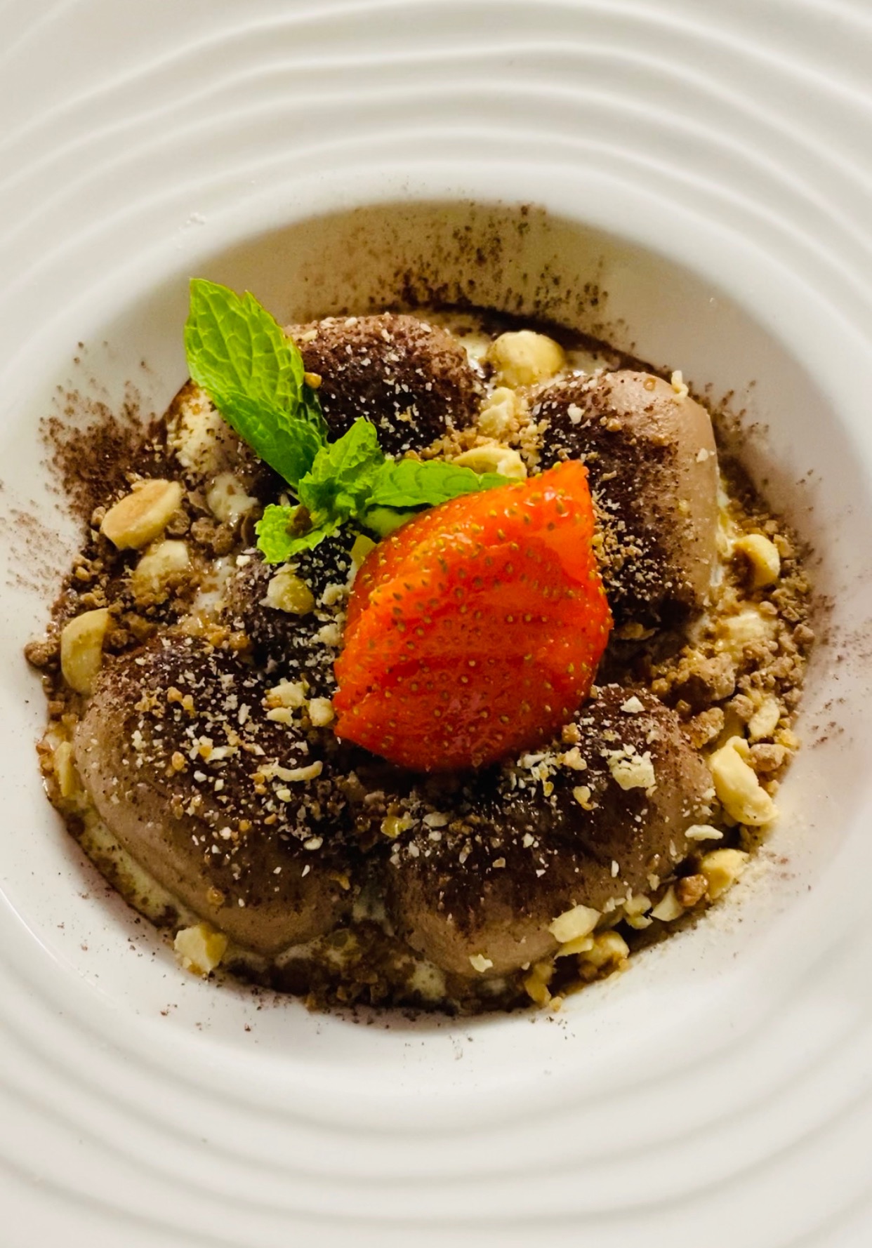 Happy Ending dessert: sweet gnocchi filled with Nutella, with strawberry, mint and a crumbly topping